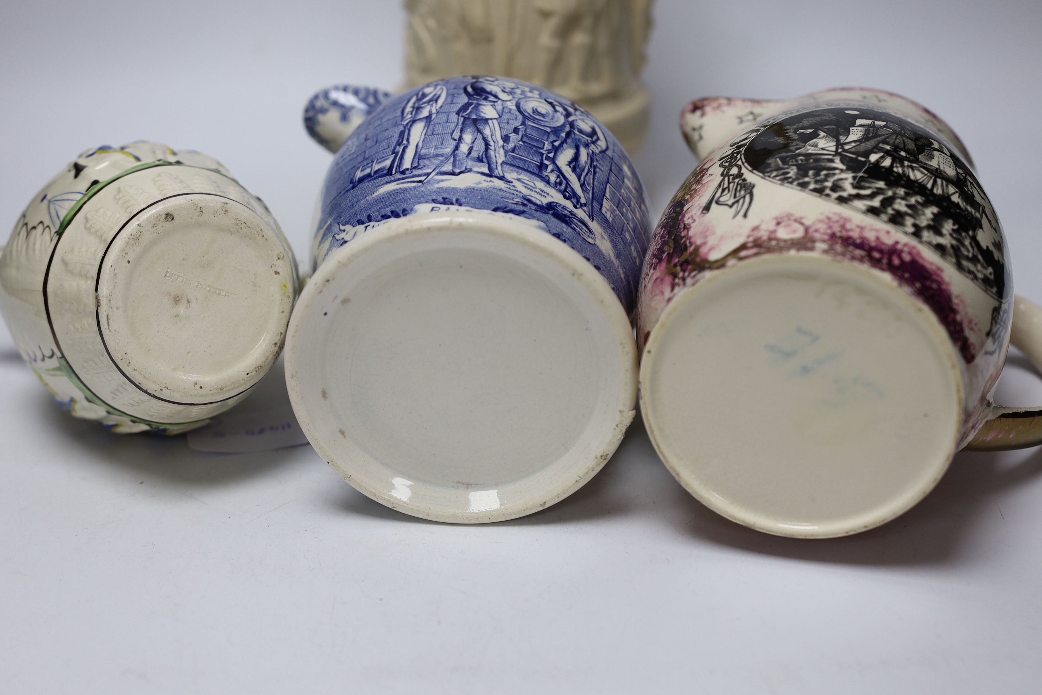 Seven military and naval themed jugs including a Leeds creamware jug 'Loyal Volunteers' inscribed 'L Volnteers' c.1803, an early 19th century success to the volunteers jug, a Sunderland pink splash lustre loving cup etc.